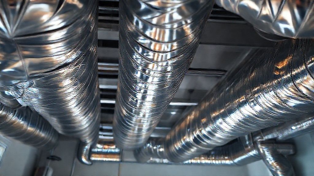 Shiny ductwork meets modern home comfort; San Diego HVAC solutions gleam.